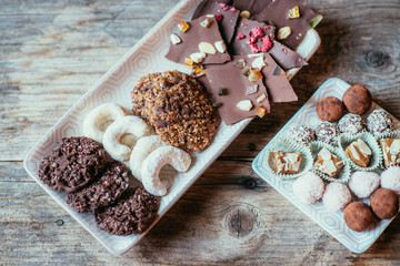 Traditional homemade Christmas cookies: Variety of sweet European cookies on rustic wooden desk, powdered sugar.