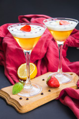 Italian dessert panna cotta with strawberries and lemon