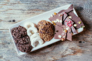 Traditional homemade Christmas cookies: Variety of sweet European cookies on rustic wooden desk, powdered sugar.