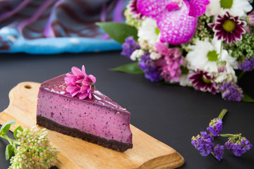 Fototapeta na wymiar Homemade cheesecake with fresh blueberries and mint for dessert - healthy organic summer dessert pie cheesecake. Creative atmospheric decoration.