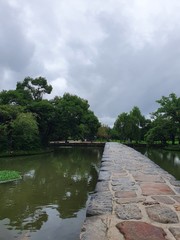 Fototapeta premium Namwon-si, Jeollabuk-do, South Korea - 24th July 2020 : Bridge and Scenery of Gwanghallu Garden or Gwanghallu Pavilion on a rainy day
