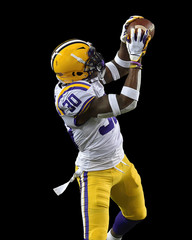 Fototapeta premium Great action photos of football players making amazing plays during a football game