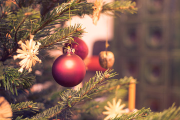 Traditional Christmas tree with Christmas decoration, close up of Christmas bauble. Postcard.