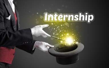 Magician is showing magic trick with Internship inscription, educational concept