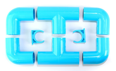 Plastic plumbing pipes and joints placed on a white background.