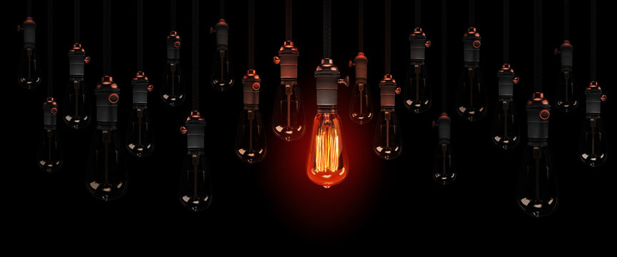 geniale idee, individualität oder herausragendes merkmal, visualisiert mit brennenden edison glühbirnen