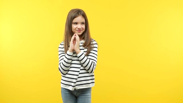 Funny little child girl devising a plan