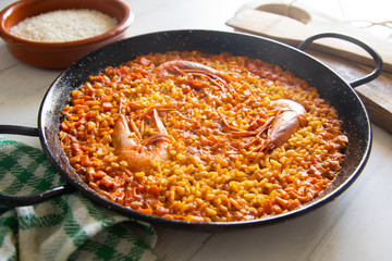 Traditional spanish paella with red prawns.