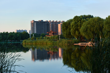 Beautiful city park skyline in the setting sun