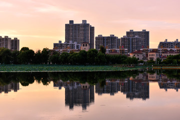 Beautiful city park skyline in the setting sun