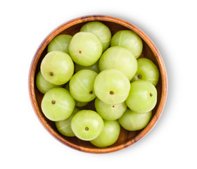 Gooseberry in wooden bowl on white.