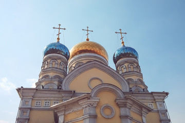 Fototapeta premium The building of the intercession Church against the blue sky.
