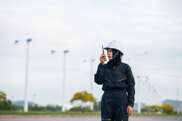 Windmill women engineer inspection and progress check wind turbine at construction site