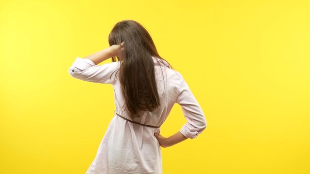 Funny little child girl from behind thinking about something