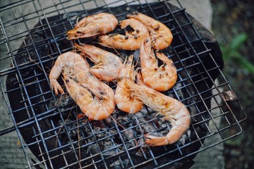 Delicious grilled shrimp and squid on food in Thailand
