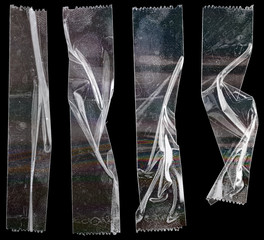 poster design overlays or elements. set of transparent adhesive tape or strips isolated on black background with rainbow surface, crumpled plastic sticky snips.