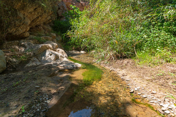 water flowing down the river between the mountains