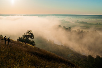 Fototapeta premium Sunrise over the cliff. Morning haze at dawn on a cliff in summer. freshness