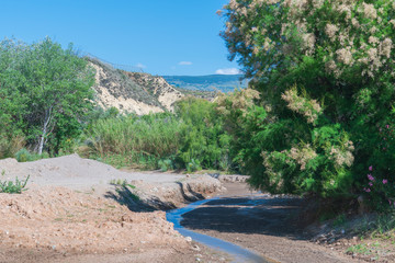 water flowing down the river between the mountains