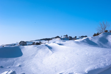 Fototapeta na wymiar Beautiful pure snowscape,winter in the mountainside outdoor.