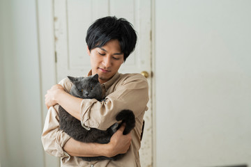 Fototapeta premium One man working remotely and a cat.
