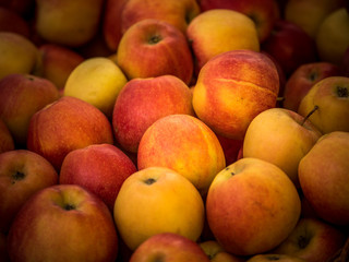 background of red apples for sale in the greengrocer's shop