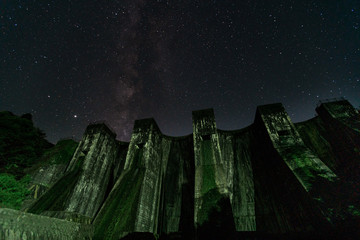 A photo of a historic dam and the Milky Way in Kanonji City, Kagawa Prefecture, Japan	