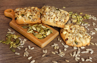 cookies with, seeds and nuts, close-up. pumpkin seeds. Fitness cookies on a wooden table. monochrome colors. Flat lay, copy space