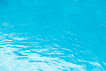 Water waves in the pool with blue background