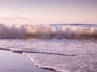 Backlit Waves Rolling In at Golden Hour