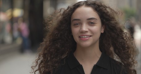Young woman in city face portrait smile happy