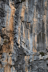 Close-up Abstract Image of Limestone Rockface with Rough Weathered Surface and Heavy Textured...