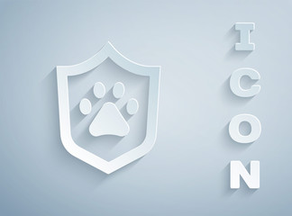 Paper cut Animal health insurance icon isolated on grey background. Pet protection concept. Dog or cat paw print. Paper art style. Vector.