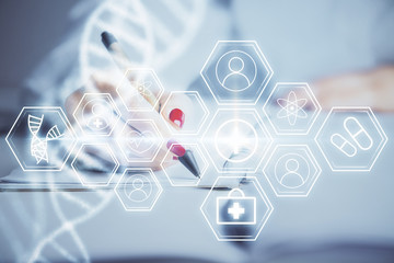 DNA theme hologram over woman's hands writing background. Concept of education. Double exposure