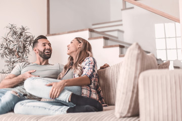 Fototapeta premium loving couple relaxing on the couch on a free evening