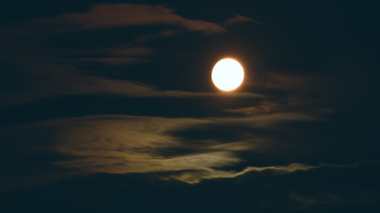 Full moon in Cumulus clouds
