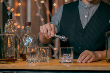 Barman pouring whiskey whiskey glass beautiful night
