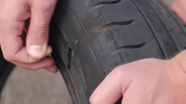 male showing through hole and tire wear, closeup