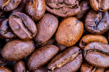 Macro shot of whole bean organic smooth medium dark roast coffee