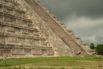 Fototapeta na wymiar The stairs of this ancient Mayan Pyramid are adorned with the figure of deity Kukulkan - the feathered serpent.