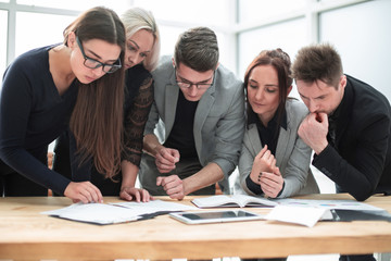 close up. business team enthusiastically discuss working documents