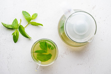 green hot mint tea in glass cup