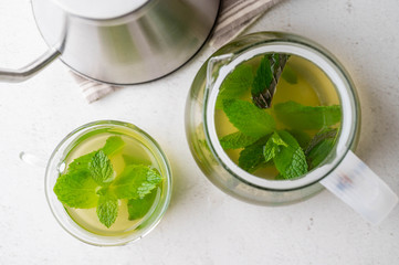 green hot mint tea in glass cup