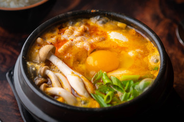 Sundubu, korean hot stone pot with tofu and pork