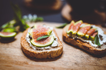 closeup of toasts with ricotta and figs