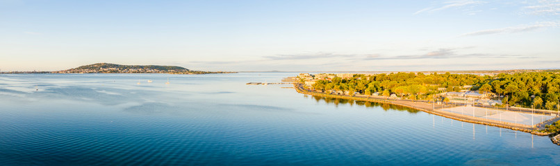 Aerial panoramic of the Thau lagoon and Mont-Saint-Clair from Balaruc, in Hérault in Occitania, France