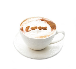 A Cup of hot cappuccino with cinnamon and lettering isolated on a white background, close-up