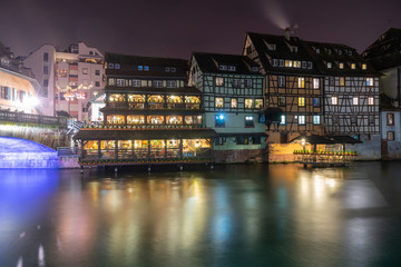 Fototapeta na wymiar Quaint timbered houses of Petite France in Strasbourg, France. French traditional houses at night