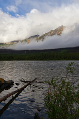 A Cloudy Pyramid Mountain over the Lake