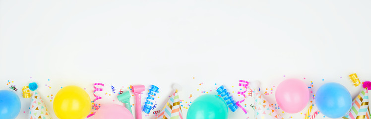 Birthday party banner with bottom border on a white background. Top down view with balloons, party...
